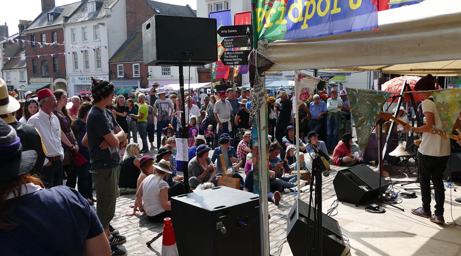 A crowd enjoys live music at Bucky Doo Square, Bridport